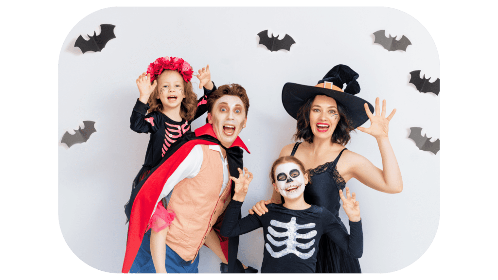 A family in Halloween costumes posing for a photo.